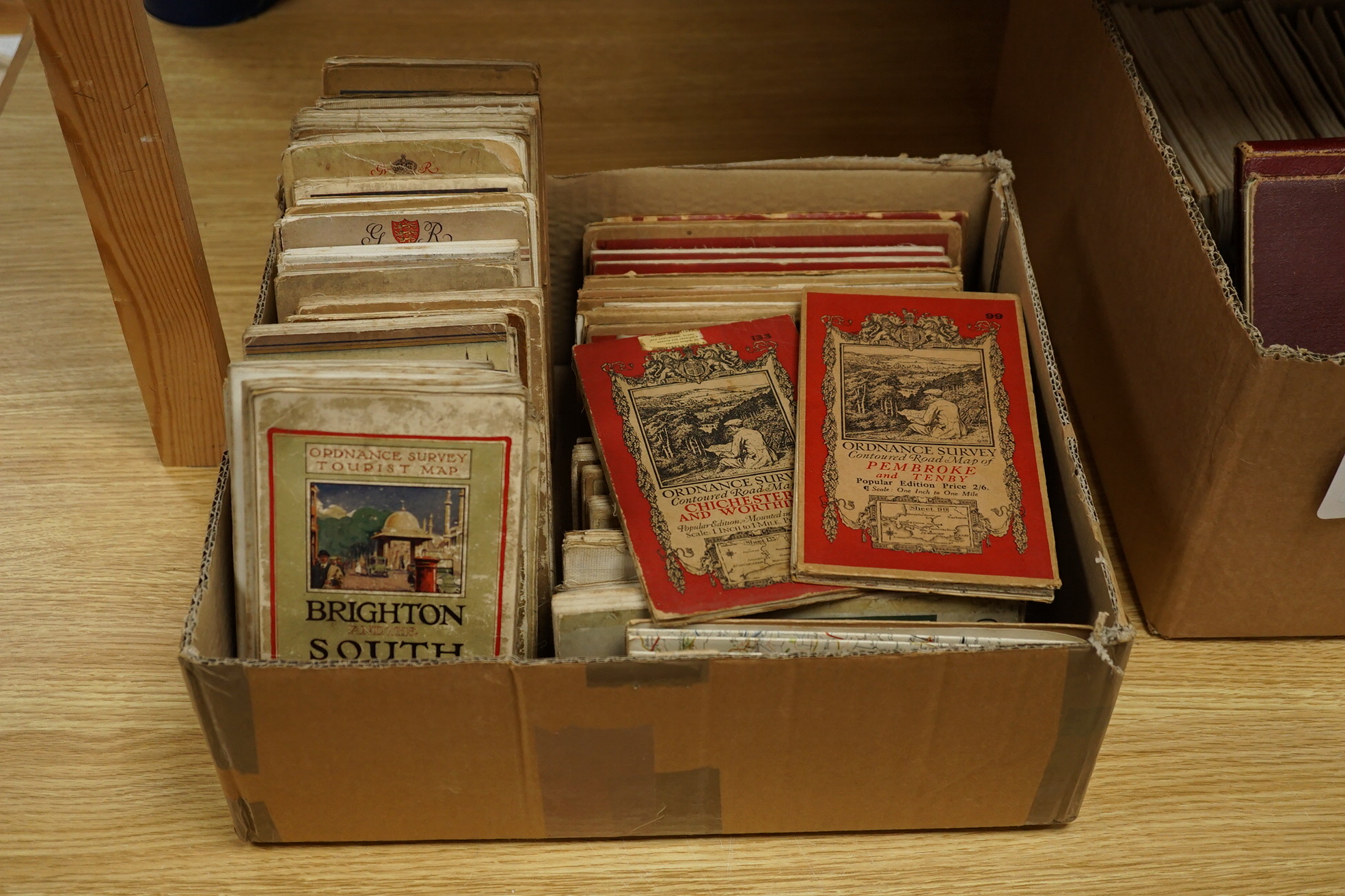 Twenty, one inch Ordnance Survey maps, together with thirty Ordnance Survey Tourist Maps, etc, 1920s/30s (50). Condition - poor to fair.